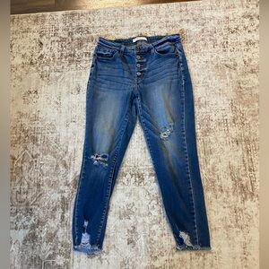 KanCan Signature mid-rise distressed skinny jeans.